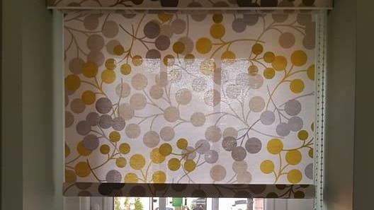 Dotted roller blinds installed in a home
