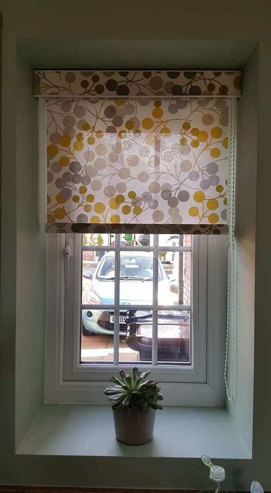 Dotted roller blinds installed in a home